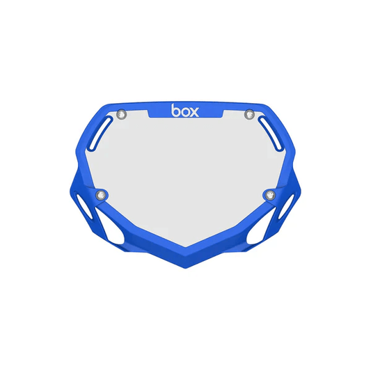 Box Two Number Plate in blue, designed for strength and aerodynamics, featuring ventilation openings and secure Velcro fasteners.